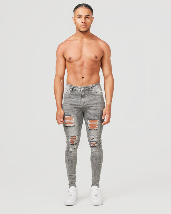 Front of grey ripped jeans for men