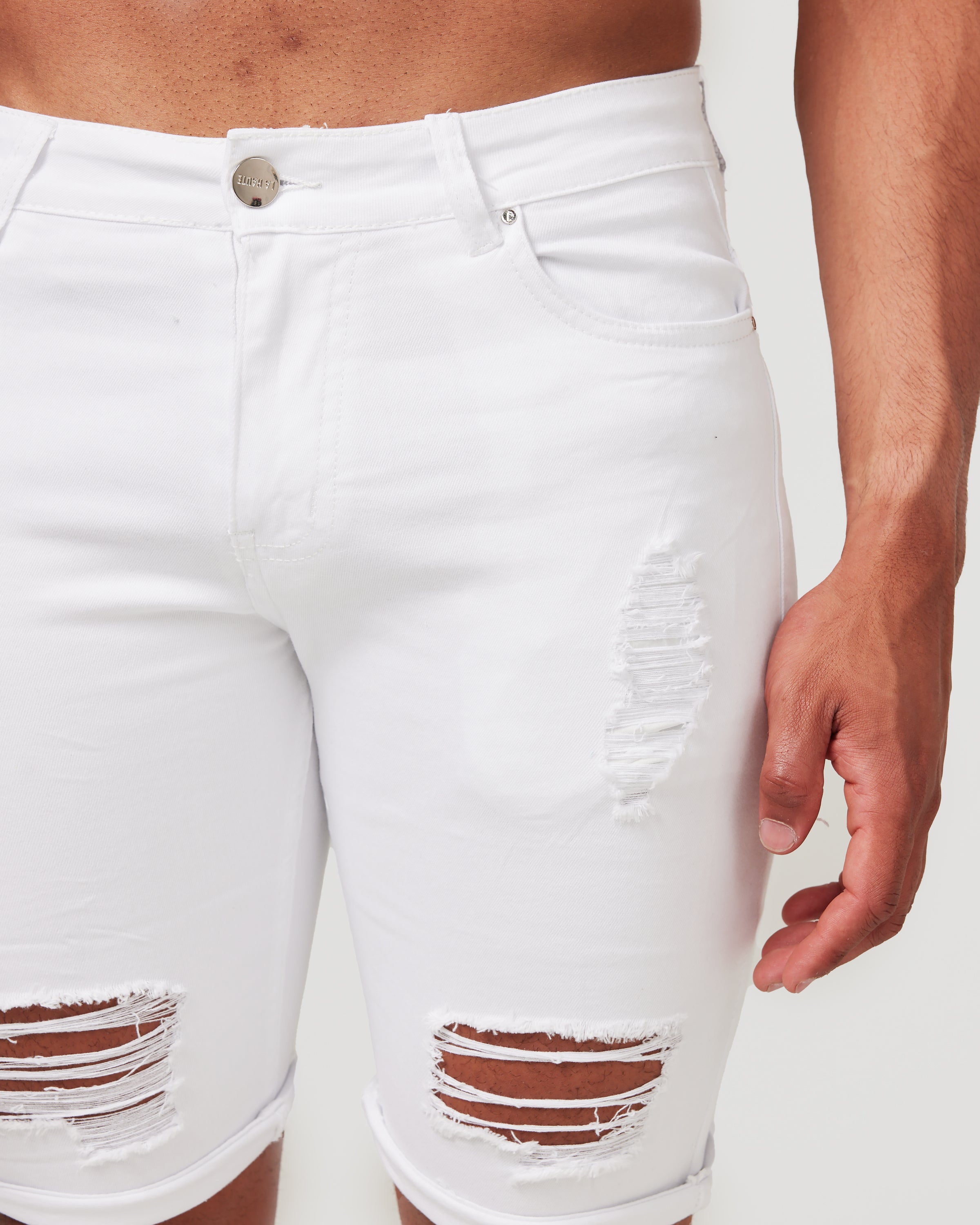 White ripped shops shorts